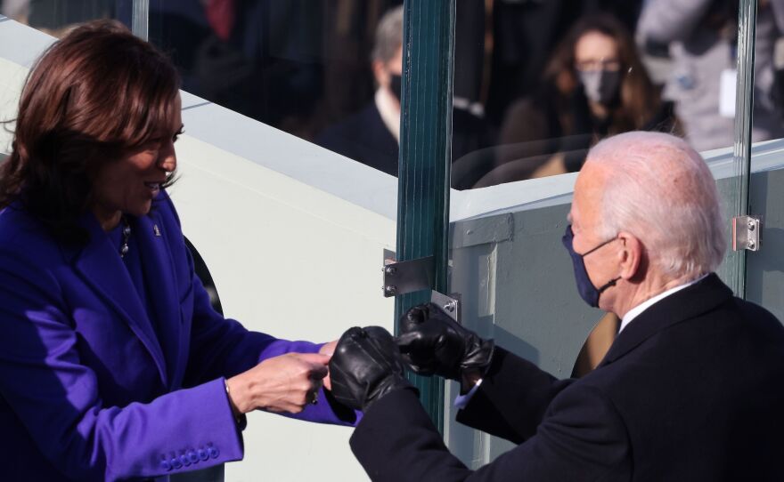 Kamala Harris celebrates with Joe Biden after being sworn in as vice president.