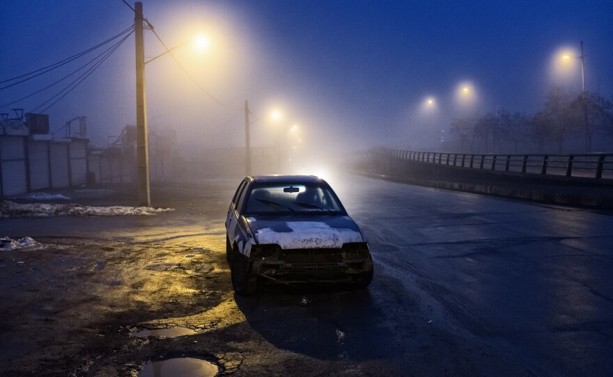 A car is abandoned on the side of the road in Tabriz city a few days after the official announcement of the coronavirus outbreak in Iran late last month.