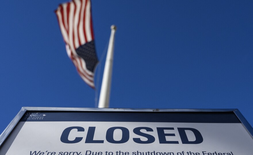 A sign is displayed on a government building in Washington, D.C., that is closed because of a government shutdown on Dec. 22, 2018. Government shutdowns happen when Congress fails to agree on additional spending to fund the government
