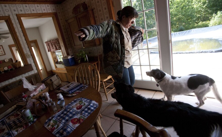 Martha leaves the house to take an elderly client grocery shopping. One of her three jobs is providing home help for seniors.