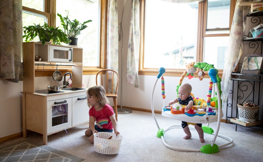Karli-Rae Kerrschneider's children, Eleanor and Leviathan, play at their home in Baldwin, Wis.