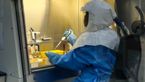 Sophia Mulei, a laboratory technologist, works with a control sample inside the Viral Hemorrhagic Fever Laboratory at Uganda Virus Research Institute in Entebbe, Uganda. The lab is one of the primary centers for the testing of Ebola samples.