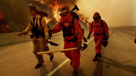 Firefighters prepare to battle a blaze November 16, 2008 in Diamond Bar, California.