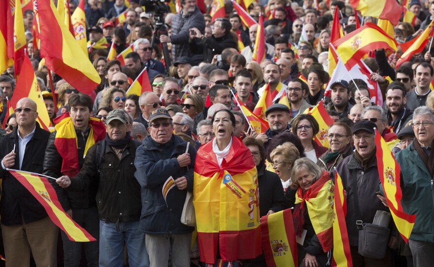 Supporters cheer on leaders of the right-wing Vox party in Madrid's Plaza de Colón on Dec. 1.