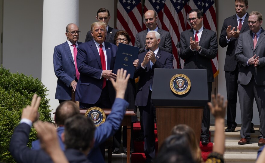 President Trump, pictured June 5, signs a bill extending the time period for businesses to use funds from the Paycheck Protection Program. On Saturday he signed a bill extending the deadline to apply for the program.