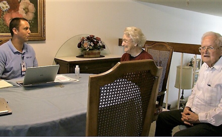 Transitions palliative care nurse Wyatt Knapp talks with Lois and Louis Alfeld in their home, April 14, 2017.