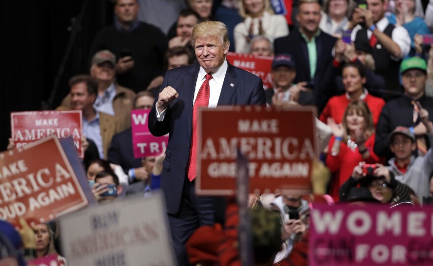 President Donald Trump acknowledges applause as he leaves the stage after speaking at a rally Wednesday in Nashville, Tenn.