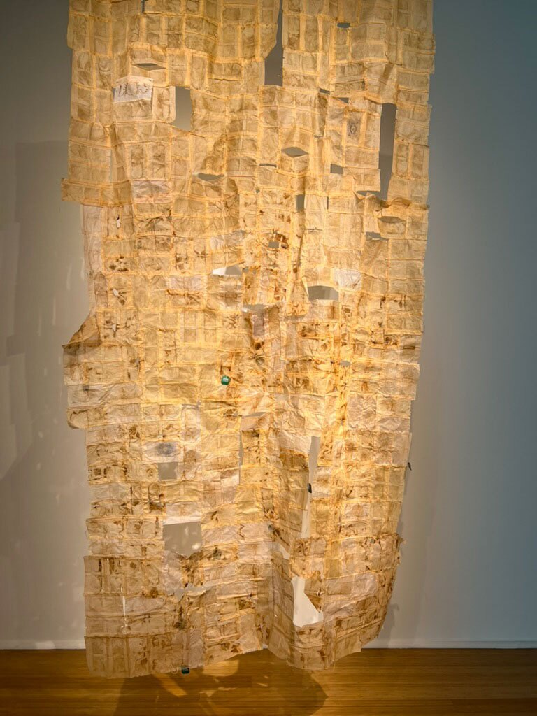 Shirin Towfiq's "Looking for a Sign" is shown in an undated photo. The work is made up of used teabags.