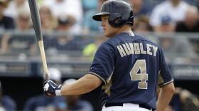 San Diego Padres' Nick Hundley looks back toward the mound at Seattle Mariners' James Paxton after striking out in the second inning of an exhibition baseball game on Friday, Feb. 28, 2014, in Peoria, Ariz. 