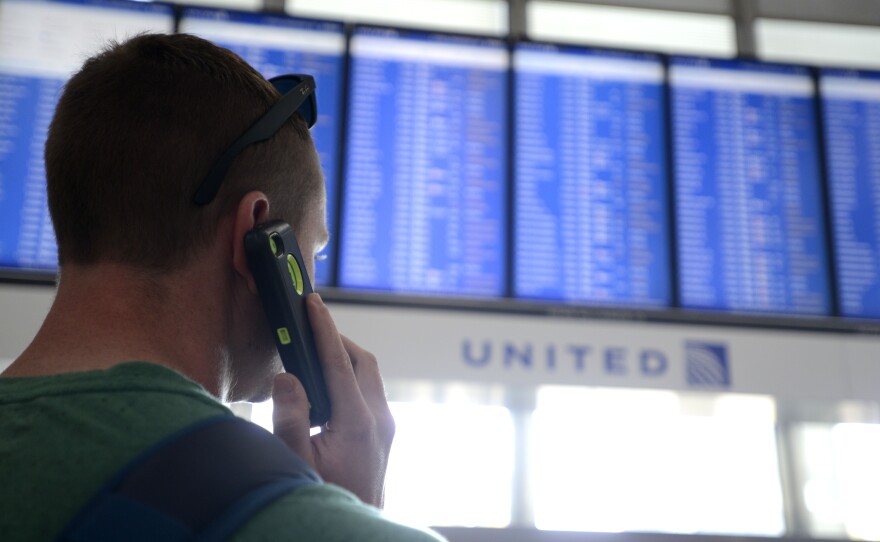 Dennis McCormack of Rockaway, N.J. checks the departure board only to find out that his flight to Newark, N.J. has been canceled at O'Hare International Airport in Chicago.