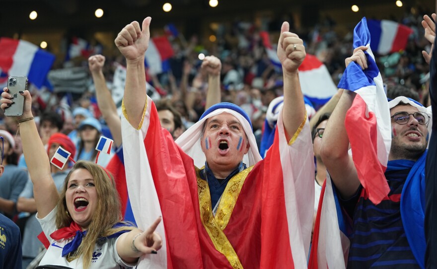 France's fans cheer their team on during the 2022 World Cup final against Argentina on Sunday, Dec. 18, at the Lusail Stadium in Lusail City, Qatar.