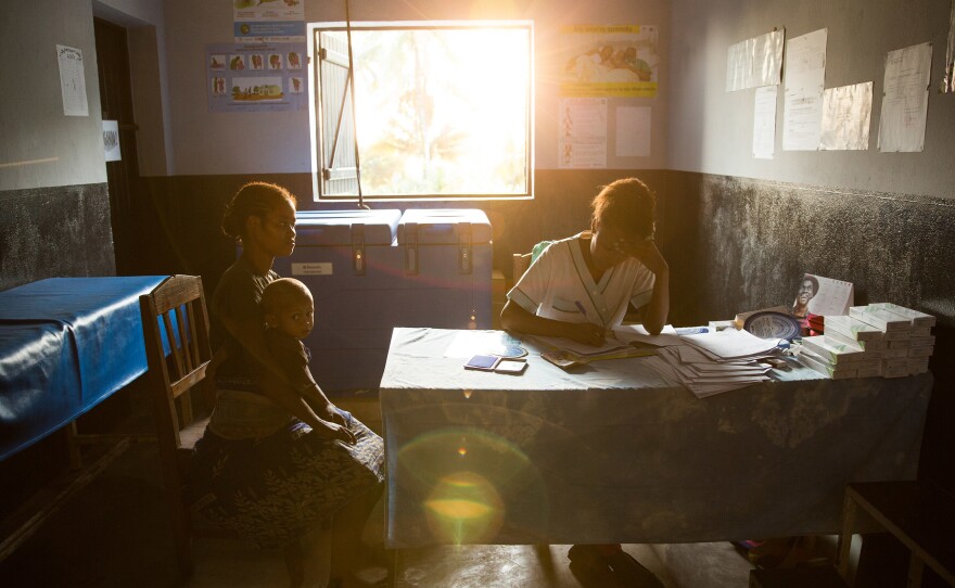 A 19-year-old woman talks with nurse Valeria Zafisoa at a traveling contraception clinic in eastern Madagascar run by the British nonprofit group Marie Stopes International.