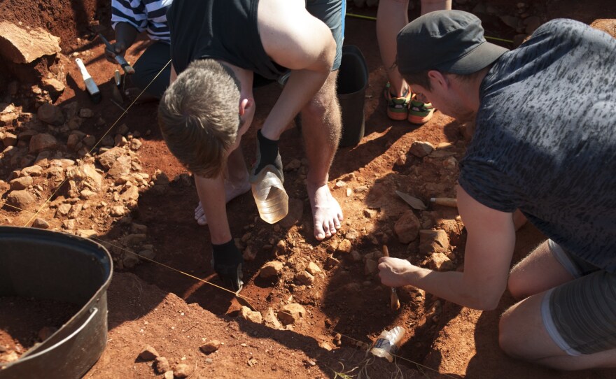 Archaeology students excavate a site at the Cradle of Humankind in South Africa in September 2015. The foot bone of a human ancestor was found in a nearby cave; it shows the oldest known evidence of malignant cancer in a hominin.