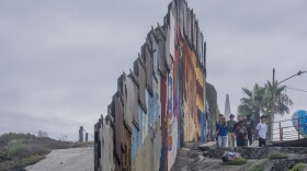 A group of American tourists visits the American-built border wall separating San Diego from Tijuana in Playas de Tijuana, Aug. 21, 2023.