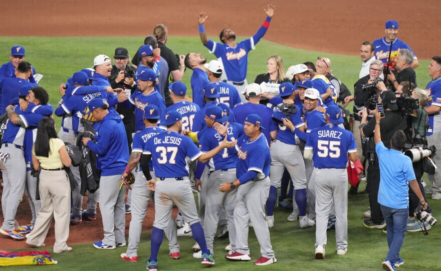 The Venezuela team celebrates after defeating the United States in the championship game of the World Baseball Classic, Tuesday, March 17, 2026, in Miami.