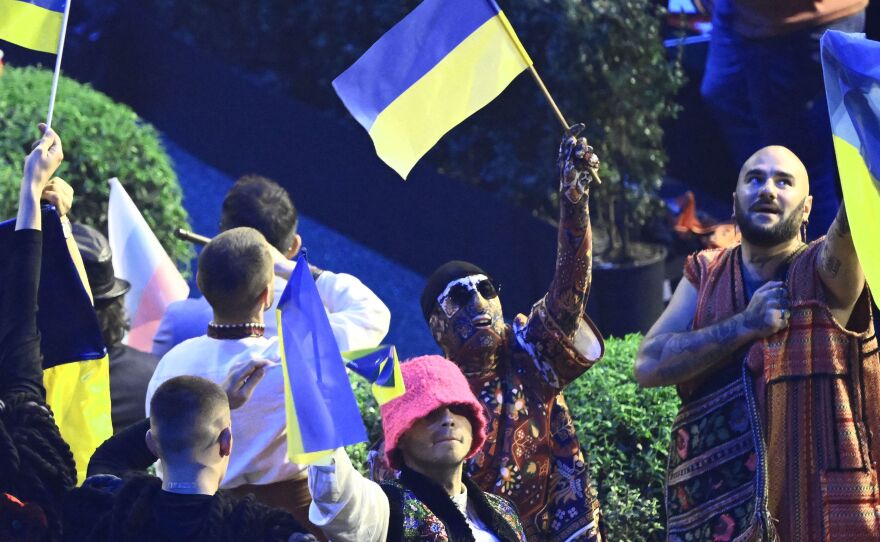 Members of Ukraine's band "Kalush Orchestra" celebrate their qualification during the first semifinal of the Eurovision Song contest 2022 on Tuesday at the Palalpitour venue in Turin. The second semifinal is on Thursday, with the grand final set for Saturday.