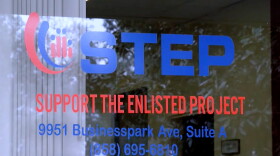 San Diego nonprofits ready to help military families during shutdown 3 The window of Support the Enlisted Project's current office featuring its logo.
