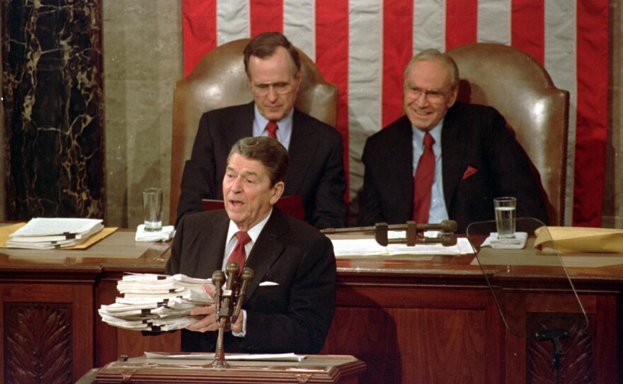 Wright (right), then House speaker, is seated behind President Reagan and next to Vice President George Bush during the 1988 State of the Union.
