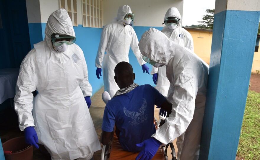 Health workers at the district hospital in Biankouma, Ivory Coast, practice handling potential patients with Ebola.