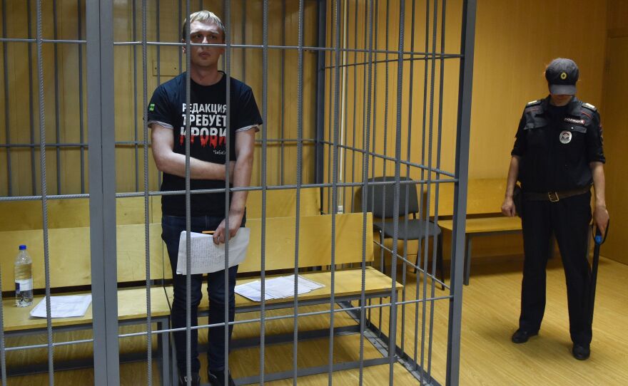 Russian investigative journalist Ivan Golunov was freed days after he was accused of attempting to sell drugs. He's seen here inside the defendants' cage during a court hearing Saturday in Moscow.