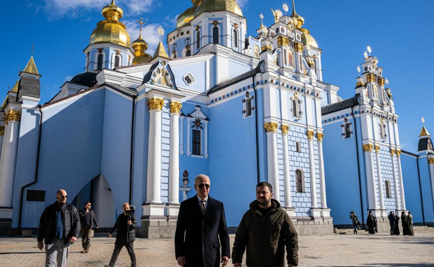 President Biden and Ukrainian President Volodymyr Zelenskyy walk in front of St. Michaels cathedral in Kyiv on Feb. 20. during a surprise visit ahead of the anniversary of Russia's war in Ukraine.