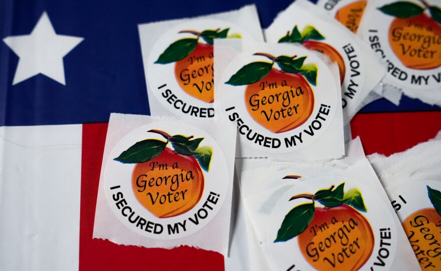 In this file photo, stickers sit on a table inside a polling place on Nov. 5, 2024, in Atlanta.