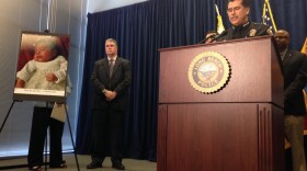 Police Chief Robert Luna, at podium, speaks during a news conference in Long Beach, Calif., March 25, 2015. Luna described how Southern California authorities have arrested four people in a plot to kidnap two newborn babies.