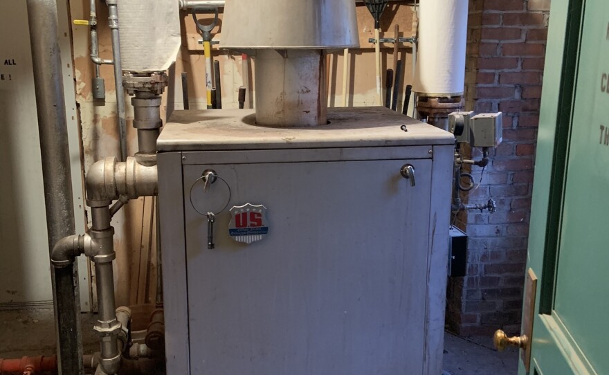 A large natural gas-fired steam boiler nicknamed "the beast" sits in St. James A.M.E. Zion Church in Ithaca, New York. As part of the city's effort to remove gas from 6000 buildings, the church plans to replace this with more efficient electric heat pumps.