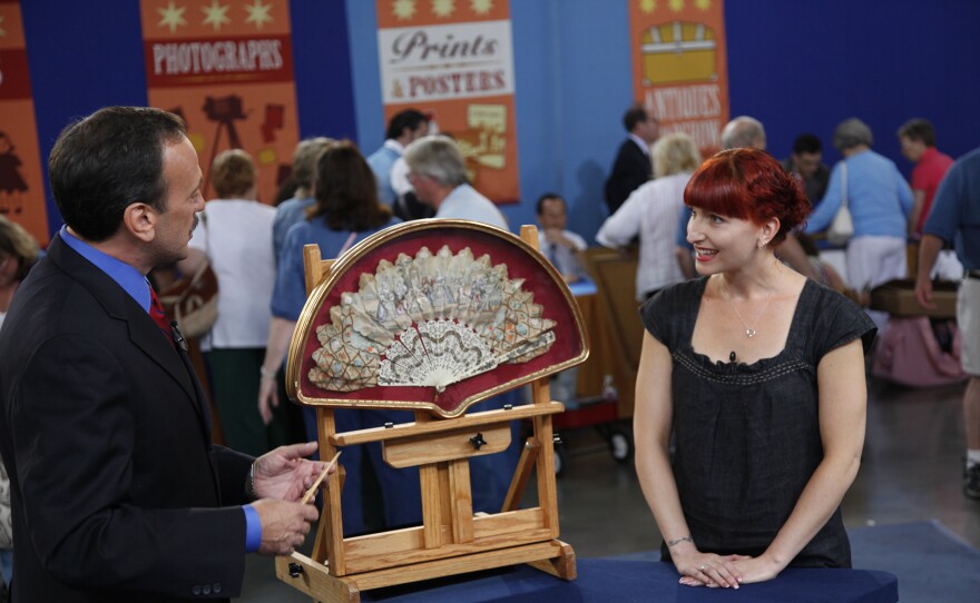 Daniel Buck Soules (left) appraises a French silk and bone fan, ca. 1800, in San Jose, Calif. ANTIQUES ROADSHOW “Vintage San Jose, Hour 1” airs Monday, September 15 at 8/7C PM on PBS.