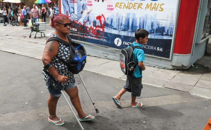 In downtown Porto Alegre, graffiti calls for the ouster of President Michel Temer.