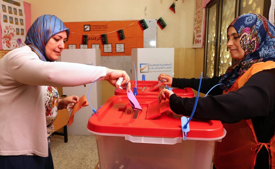 A Libyan woman cast her ballot during legislative elections Wednesday in the capital Tripoli. The voting came at a time when many Libyans were fed up with the chaos and unrest in the country.