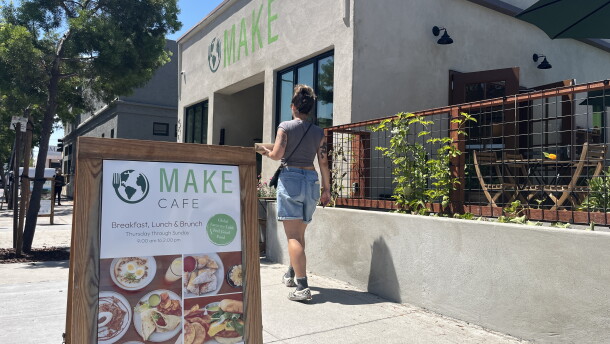 A woman walks by the Make Cafe building in Normal Heights, Aug. 21, 2026.