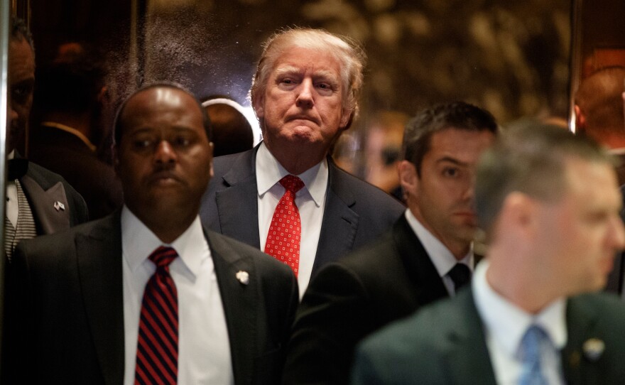 President-elect Donald Trump gets on an elevator Monday after speaking with reporters at Trump Tower in New York.