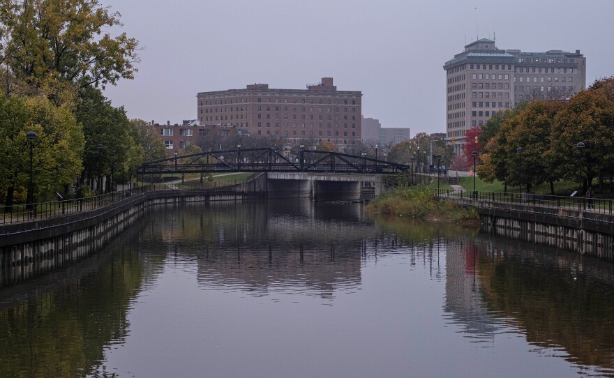 The Flint River flows past downtown Flint, Mich., in 2020. Many city residents still don't fully trust the safety of their tap water.