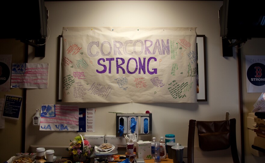 A banner reading "Corcoran Strong" hangs on the wall of Celeste and Sydney's hospital room.