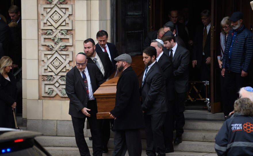 Pallbearers carry the caskets of brothers Cecil Rosenthal, 59, and David Rosenthal, 54, on Tuesday in Pittsburgh, Pa. The brothers were among 11 killed in the mass shooting at the Tree of Life Synagogue last Saturday.
