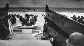 Normandy Invasion, June 1944. Army troops wade ashore on "Omaha" Beach during the D-Day landings, June 6, 1944. They were brought to the beach by a Coast Guard manned LCVP.