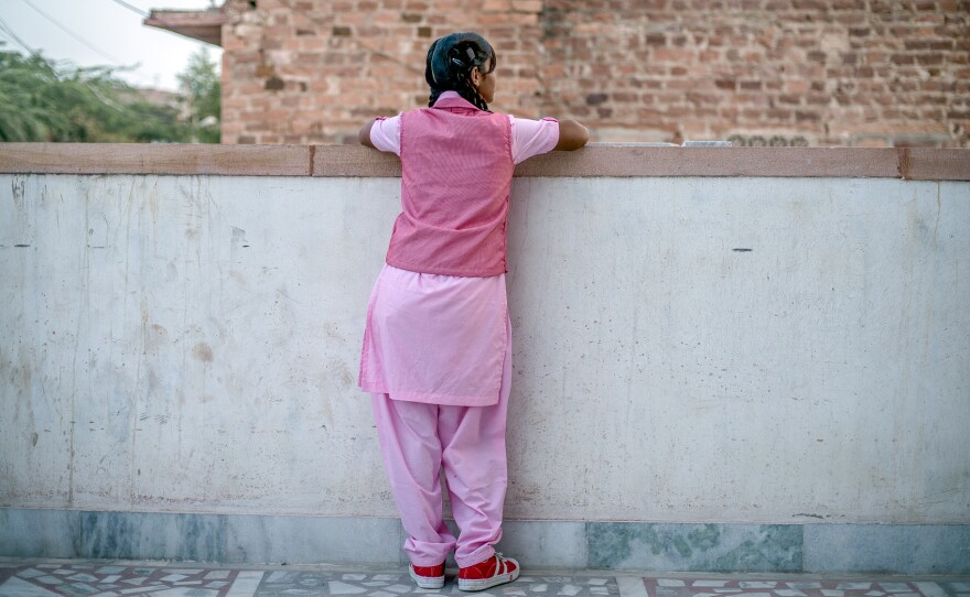 Nimmu, 15, on the terrace of the Veerni Institute. To stay in school, she needs to pass a national test this March. The problem: "I'm not a great student," she says. Because child marriage is illegal in India, we can't use her full name.