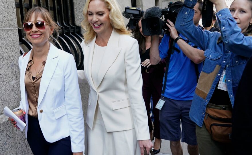 Annie Farmer (left) and her lawyer Sigrid McCawley arrive at US District Court for the Southern District of New York on June 28, 2022, for the sentencing hearing of Ghislaine Maxwell.