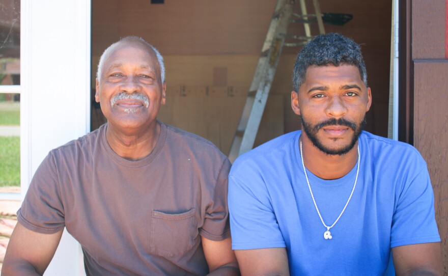 Cairo residents Lee Wright and son Roman Wright take a break from construction work earlier this summer. Both decided not to get vaccinated. "I'm like my dad," Roman Wright says. "I was born and raised in church all my life. So I say we believe in God. I know my parents pray for me. We pray for each other, and we just believe in God."