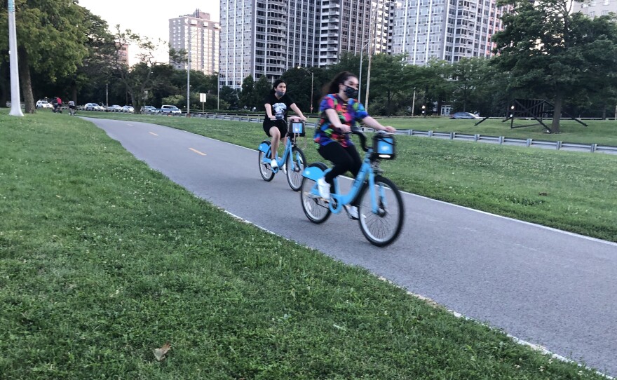 Cyclists enjoy a ride on Chicago's Lakefront Trail on a recent evening. Biking there and all across the country is up significantly during the pandemic.