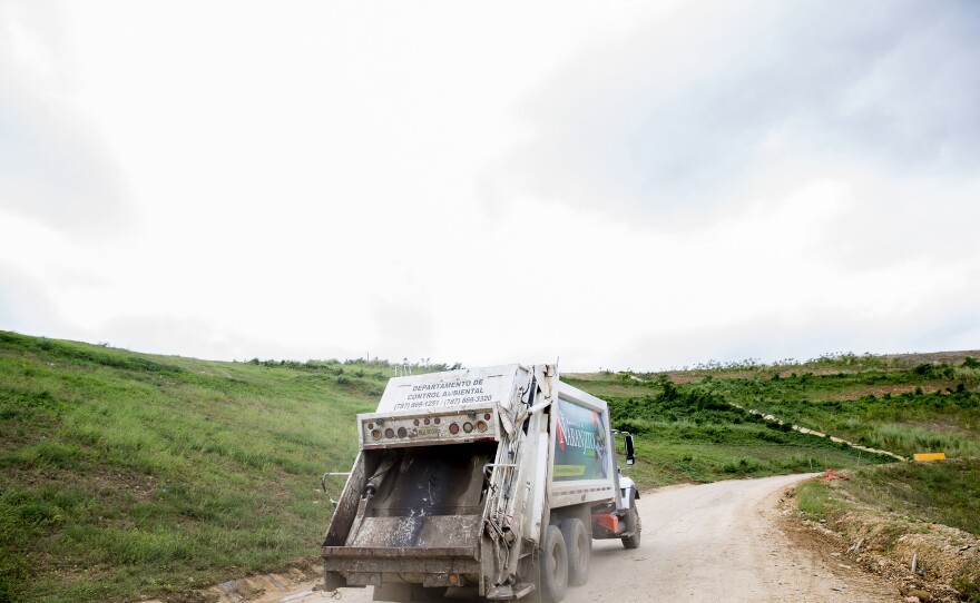 A truck drives past a closed section of the municipal landfill in Toa Baja, which is near Puerto Rico's capital city of San Juan.