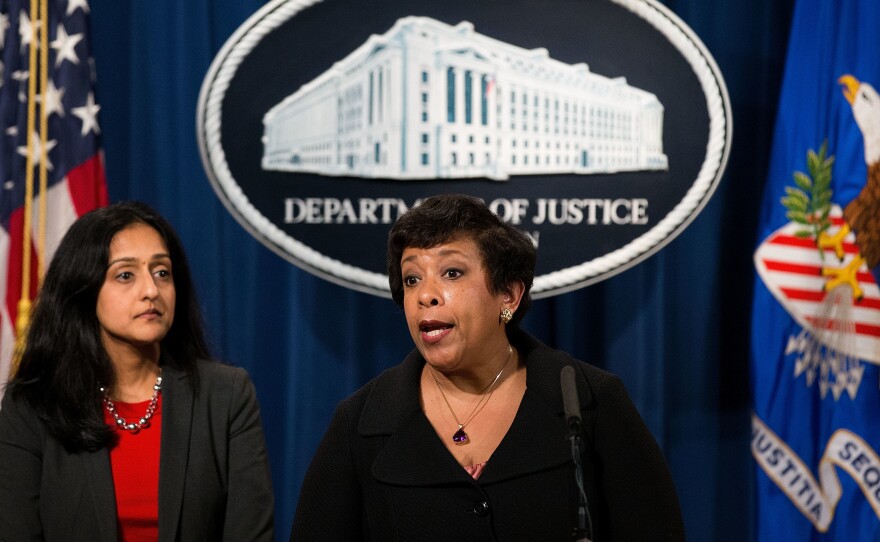 Gupta looks on as Attorney General Loretta Lynch announces federal action related to North Carolina last month.