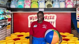Morgan Bennett of Jamaica is a student guest worker at Funland, a beachside amusement park in Rehoboth Beach, Del. For the first time since the pandemic began, international student workers will be a big part of the park's staff.