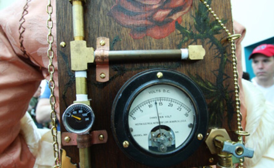 The "mechanical" box fastened to Gail's back is part of her character R.O.S.E.'s power source. It was built by her husband, Scott Folsom.