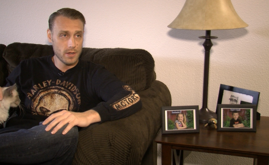 Ryan Thorne and his cat "mew" sit in his affordable apartment at the Promenade at Creekside in San Marcos, Jan. 9, 2017.