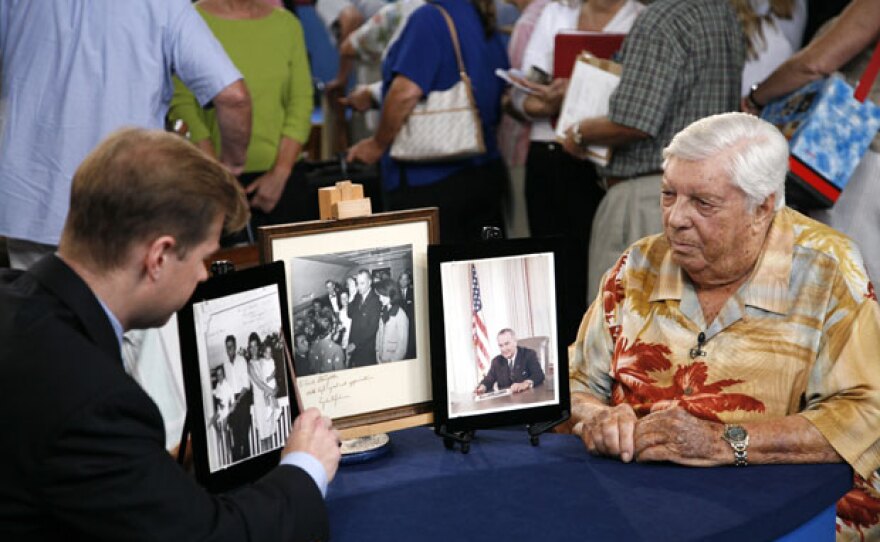 Francis Wahlgren gives an appraisal for signed photos of Presidents John F. Kennedy and Lyndon B. Johnson, valued at $75,0000.