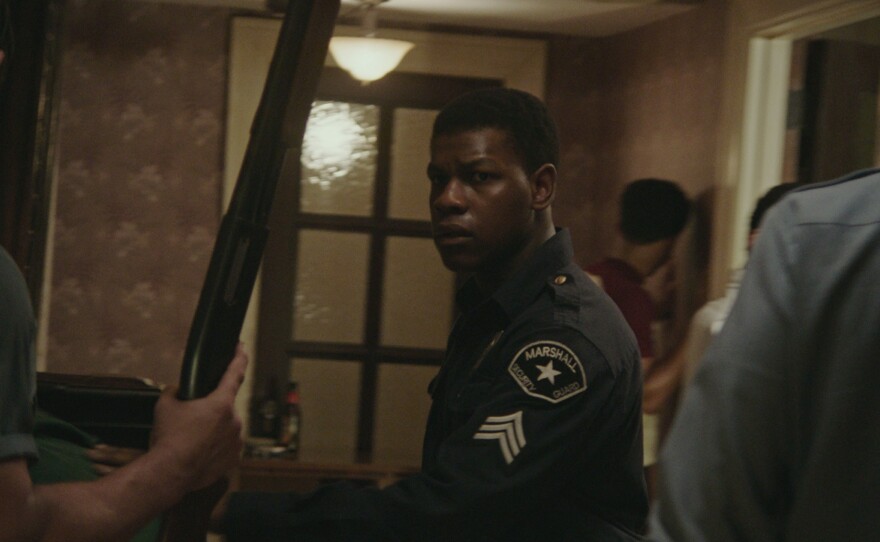 John Boyega plays a security guard who tries to help reduce tensions at the Algiers Motel in "Detroit."