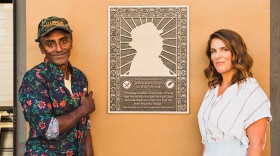 Marcus Samuelsson and Vivian Howard stand beside Jonathan Gold's honorary plaque outside of Grand Central Market in Los Angeles.
