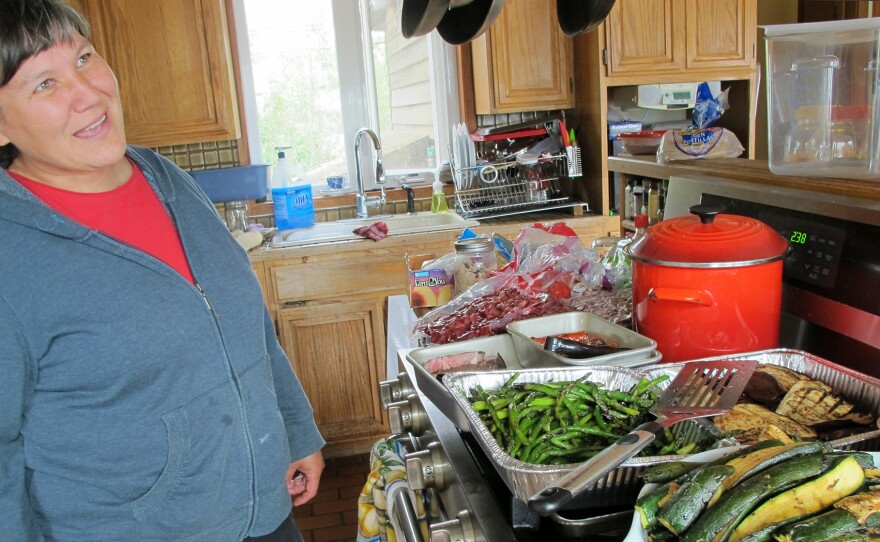 Davidson prepares dinner for 50 in her kitchen in Bethel, Alaska.